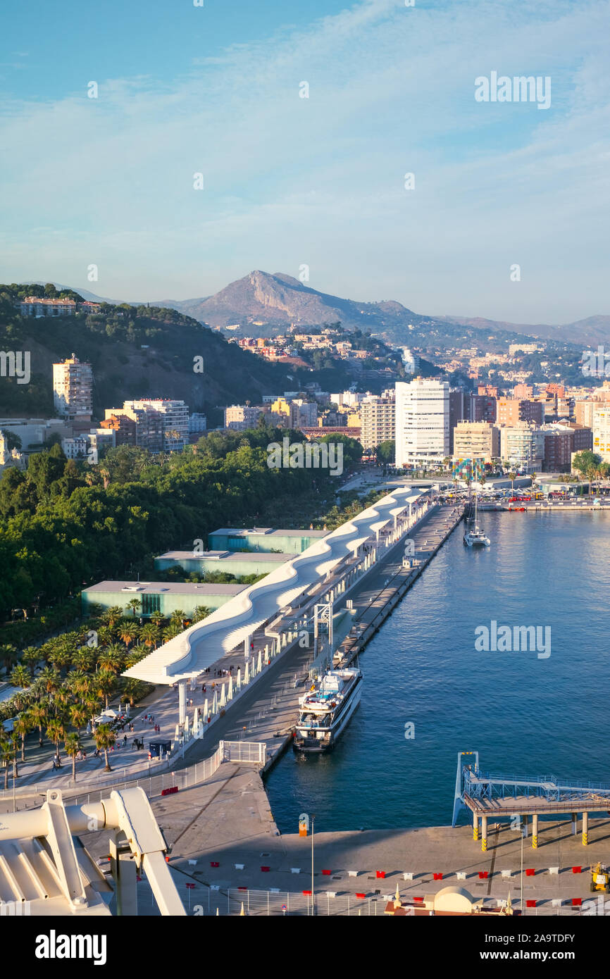 Malaga, Spain - June 29, 2018. Panoramic view of the Malaga city, Cathedral of the Incarnation, palatial fortification Alcazaba, Marriott hotel, Water Stock Photo