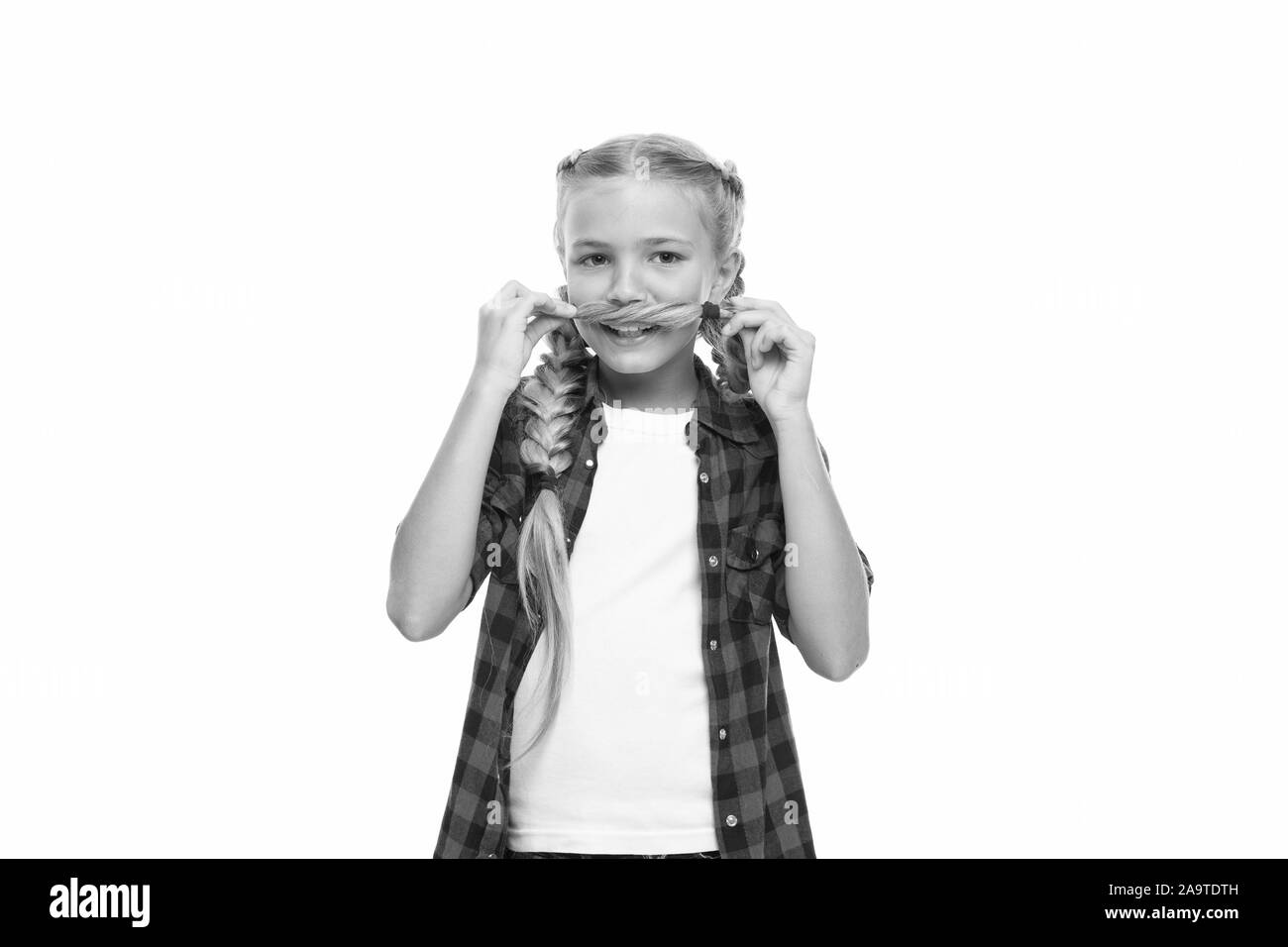 Try mustache on. Facial hair concept. Girl long braids white background isolated. Keep hairstyle braided for healthier hair. Kid play with long braided hair as she have mustache. Hairdresser salon. Stock Photo