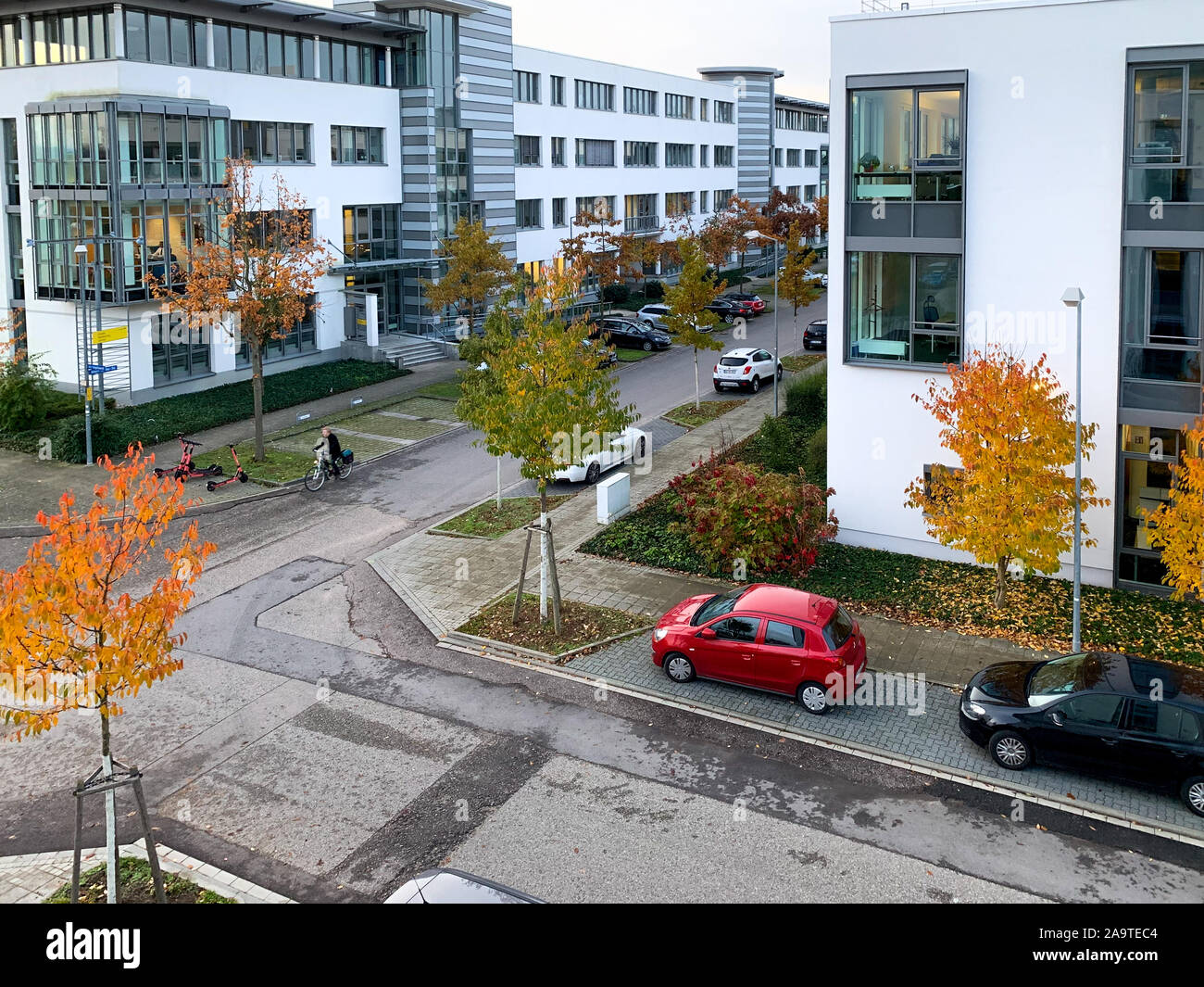 Urban and modern office landscapes with intersection and several different houses during autumn Stock Photo