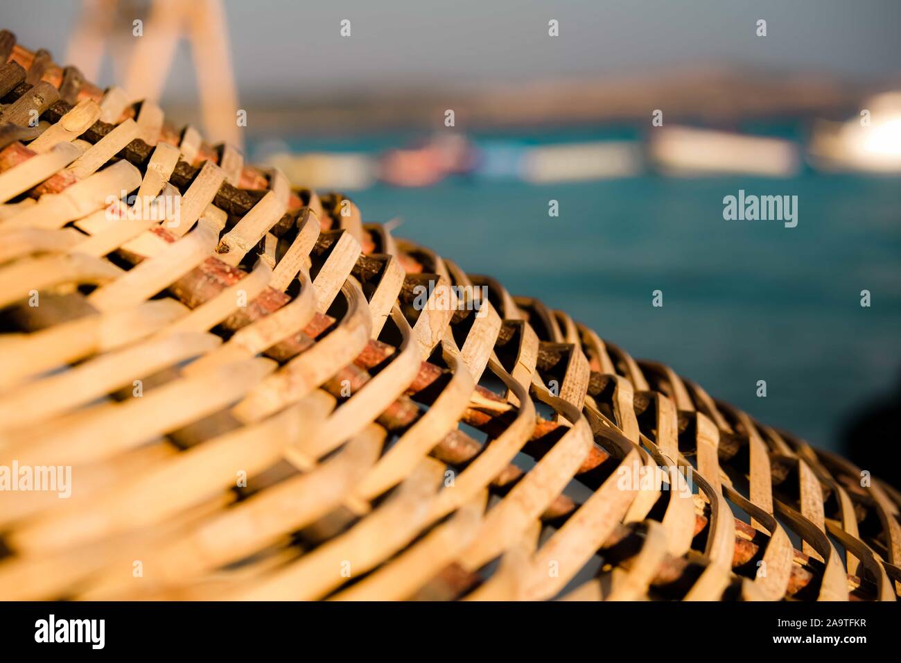 Natural bamboo reed straw beach umbrella. Closeup. selective focuse. Stock Photo