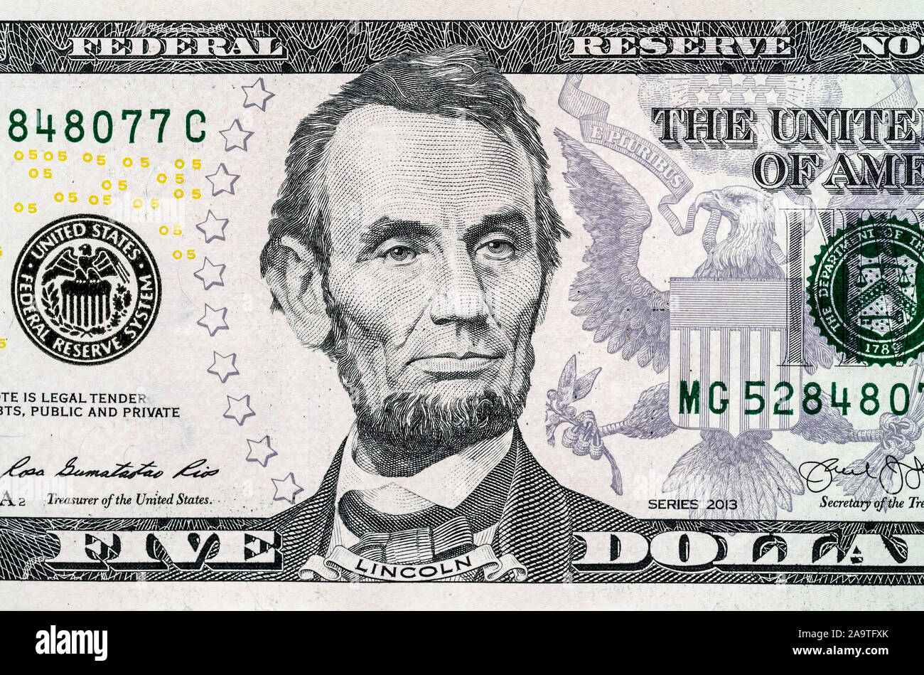 Close-up portrait of Abraham Lincoln on a 5 US dollars banknote. Stock Photo