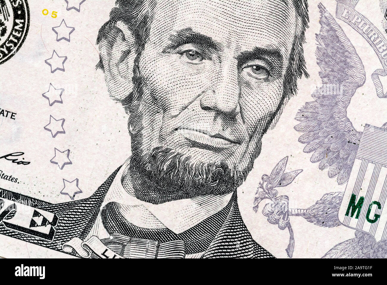 Close-up portrait of Abraham Lincoln on a 5 US dollars banknote. Stock Photo