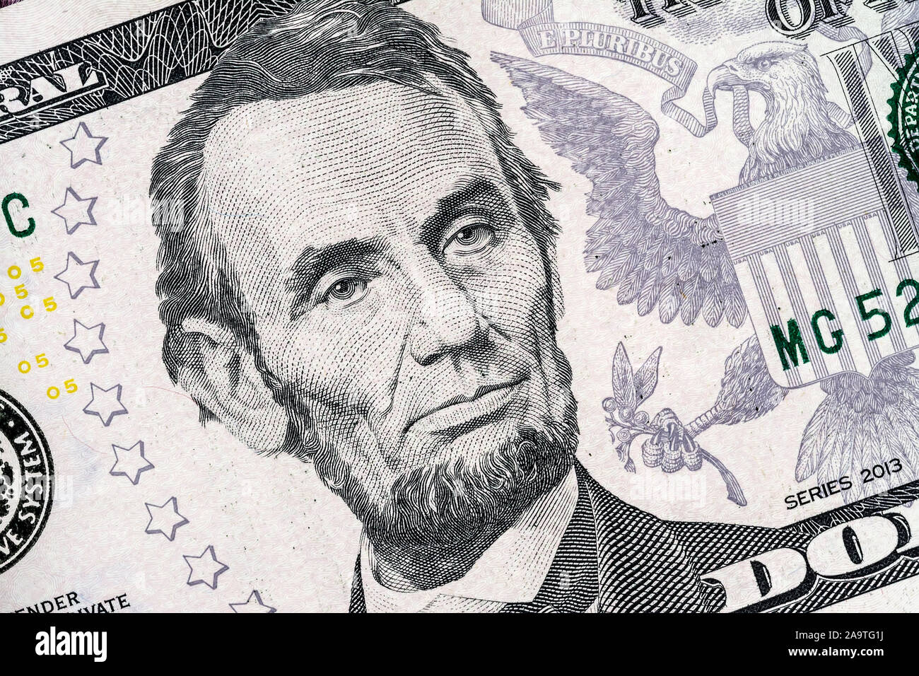 Close-up portrait of Abraham Lincoln on a 5 US dollars banknote. Stock Photo