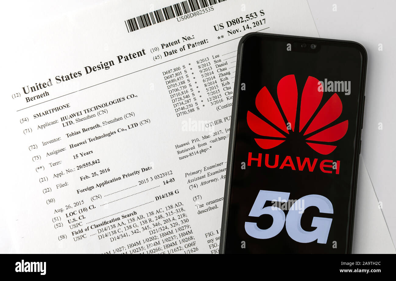 HUAWEI US patent on Chinese smartphone technologies patented in the US and mobile device with HUAWEI 5G logo. Stock Photo