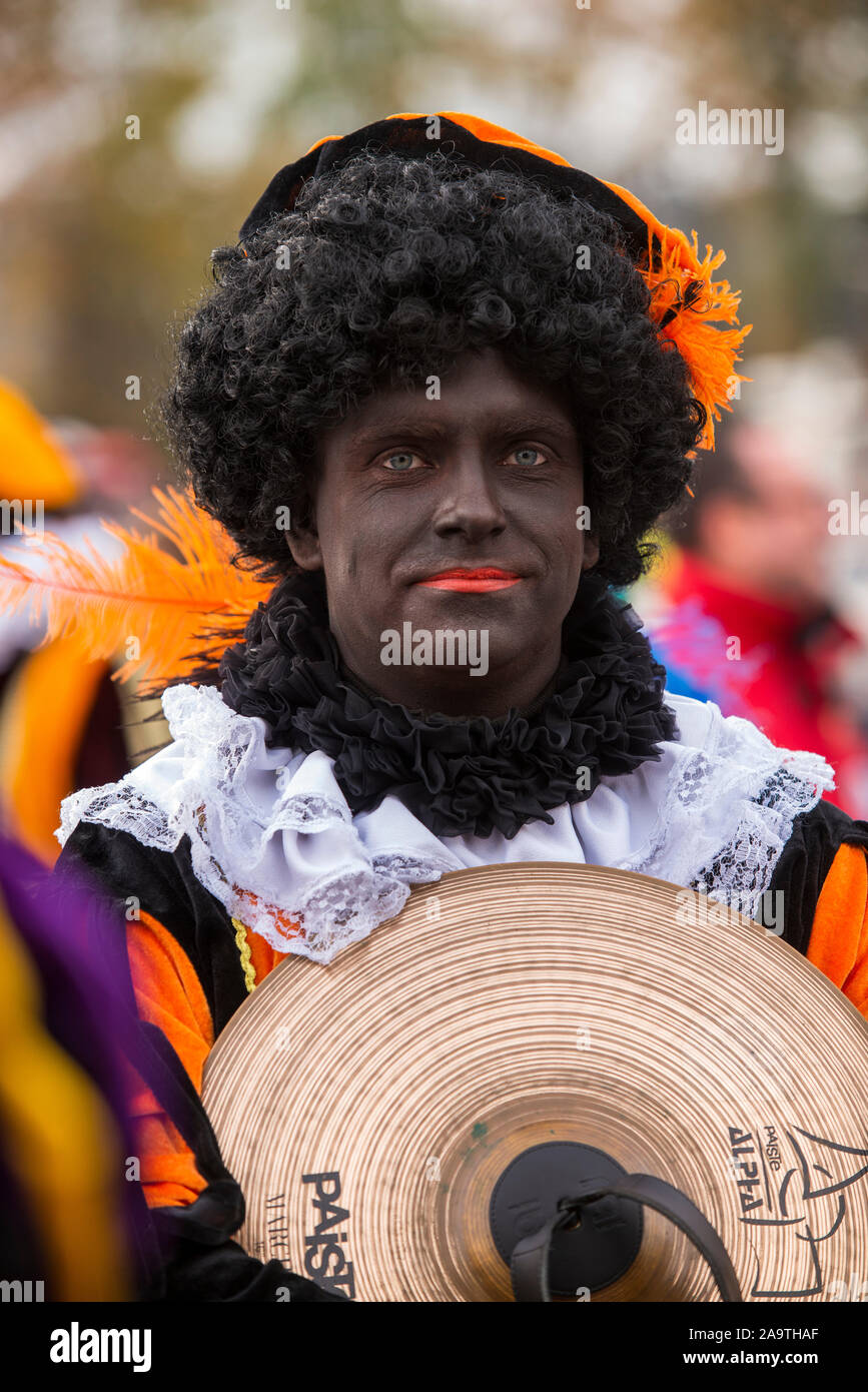ENSCHEDE, THE NETHERLANDS - NOV 16, 2019:  Black pete is the helping hand of the dutch Santa Claus called Sinterklaas. Stock Photo