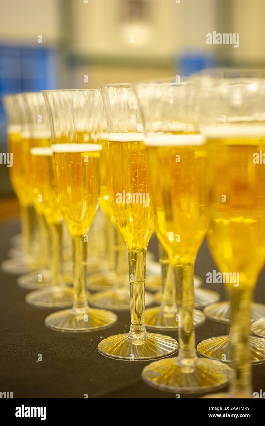 Eye-level shot of fluted champagne glasses filled with liquid during the first annual First-Year Banquet, formerly the High Table event, at the Johns Hopkins University, Baltimore, Maryland, March 2, 2010. From the Homewood Photography Collection. () Stock Photo