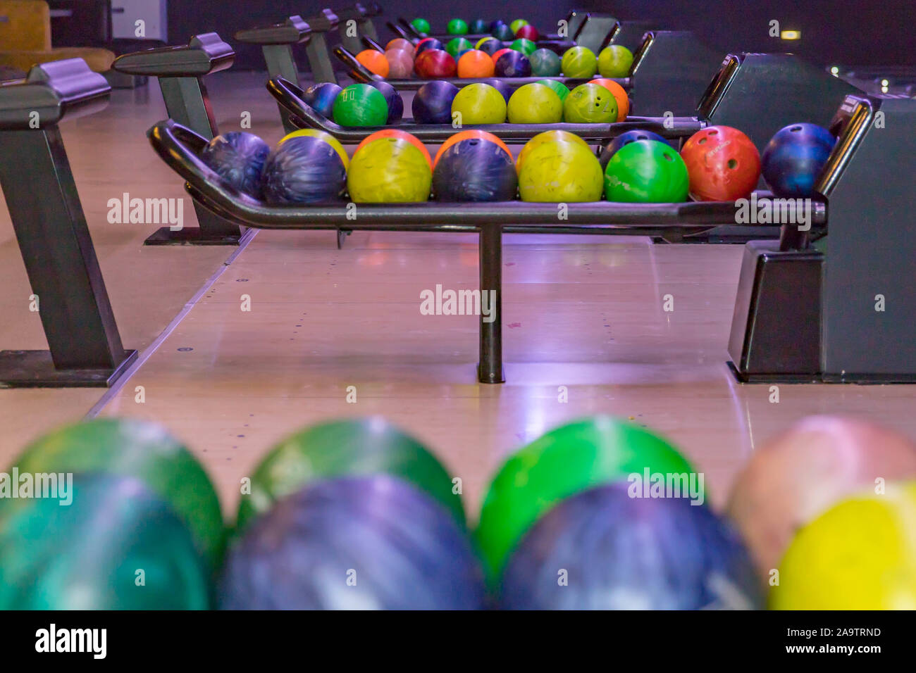 Close up of bowling balls and bowling pins in bowling club. Bowling