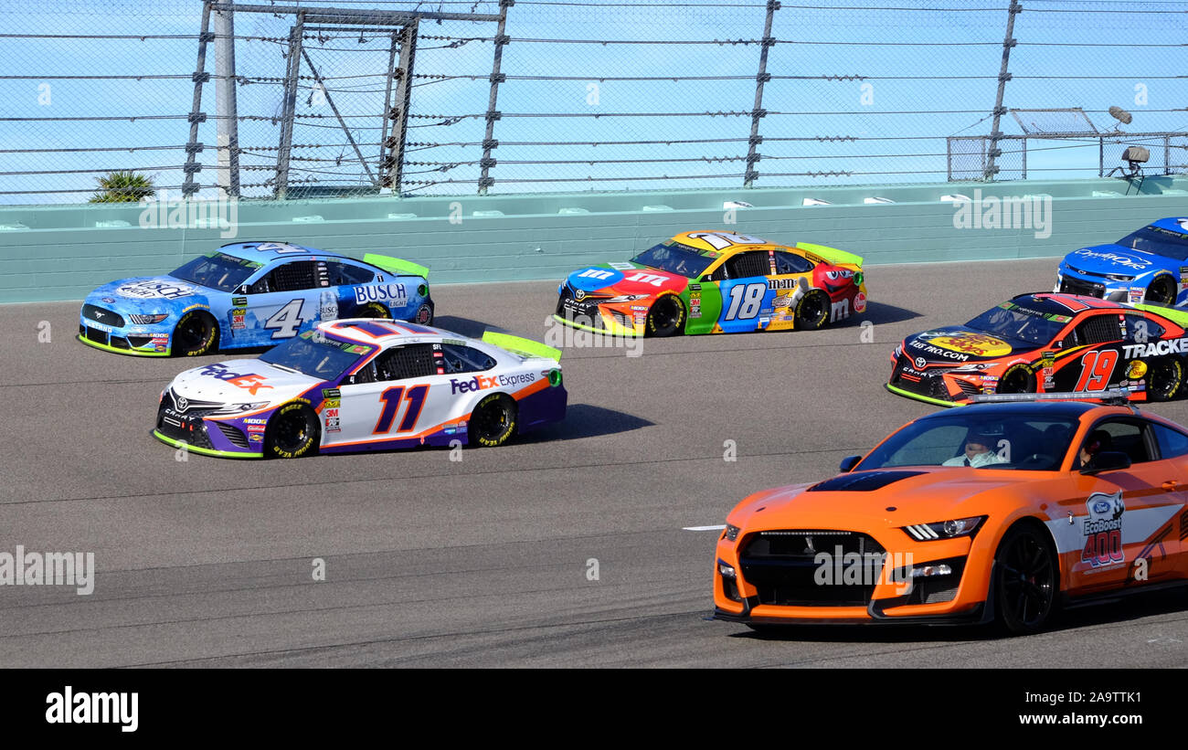 Homestead, United States. 17th Nov, 2019. Denny Hamlin (11), Kevin Harvick (4), Kyle Bush (18) and Matrtin Truex Jr. (19) enter turn four as the pace car leaves at the start of the NASCAR Ford EcoBoost 400 Cup Series Championship at Homestead-Miami Speedway in Homestead, Florida on Sunday, November 17, 2019. This is the last championship race to be held at the Homestead-Miami Speedway. Next season the championship will move to Phoenix, Arizona. Photo By Gary I Rothstein/UPI Credit: UPI/Alamy Live News Stock Photo