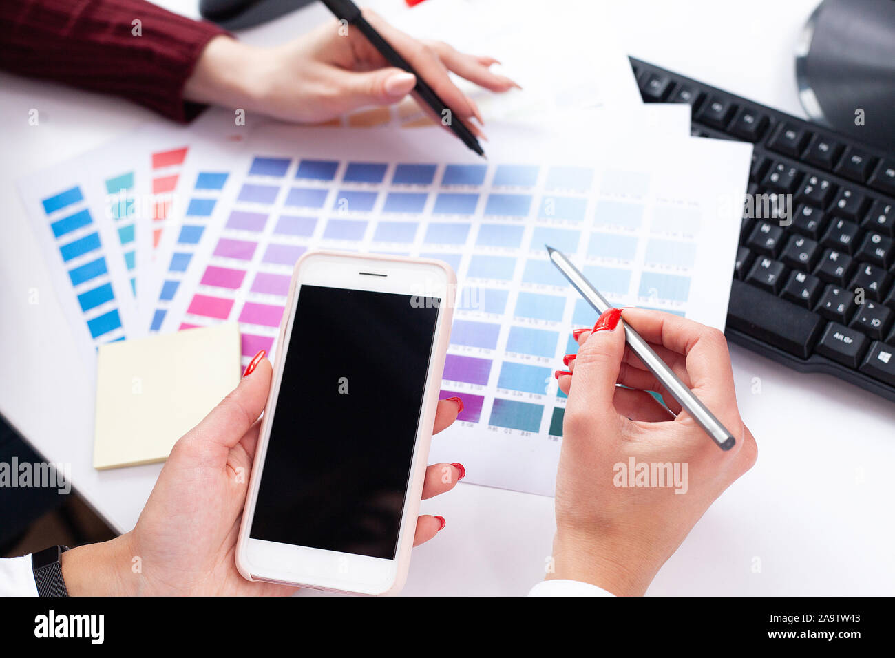 Woman Designer Working On Computer In Office on Modern Desktop Computer Stock Photo
