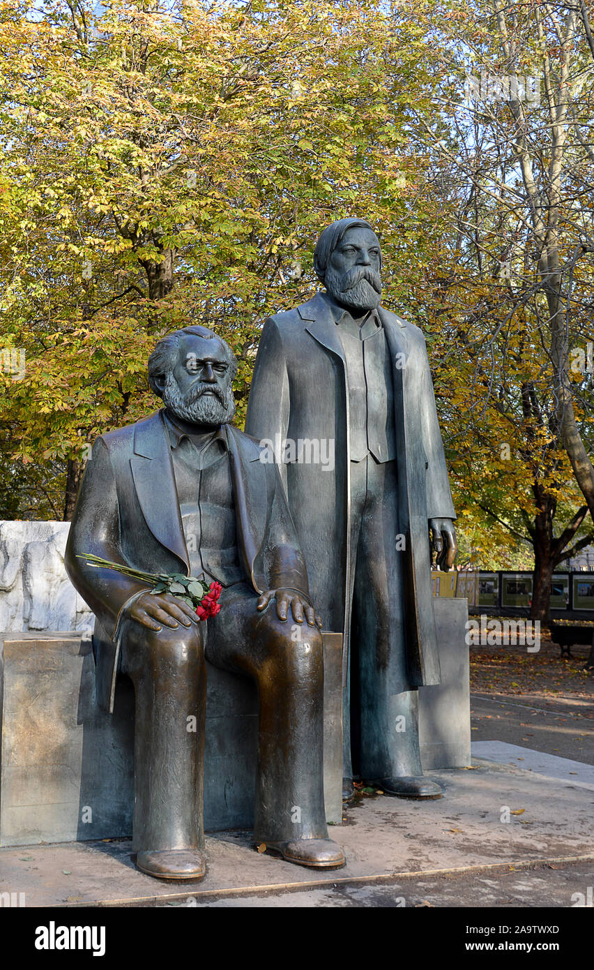 BERLIN, GERMANY -10 NOVEMBER 2019: Statues of Karl Marx and Friedrich Engels erected in the Marx-Engels Forum, a park beside Alexanderplatz, by the Ea Stock Photo