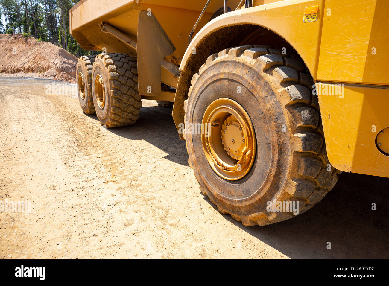 Gold mine dump truck tires are seen in an opencast quarry. Heavy