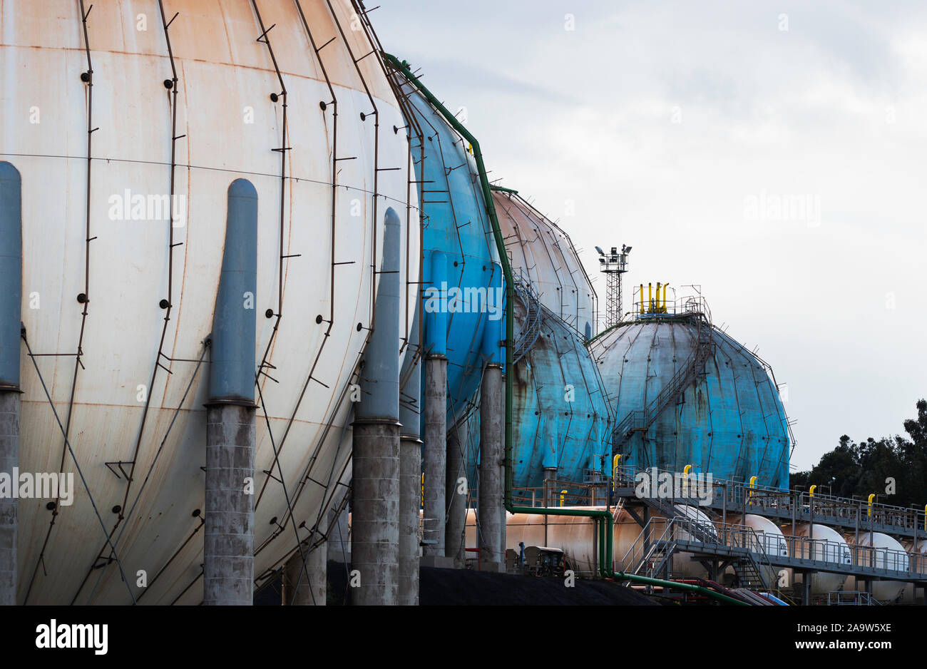 Spherical Natural Gas Tank in the Petrochemical Industry in daylight, Gijon, Asturias, Spain. Stock Photo