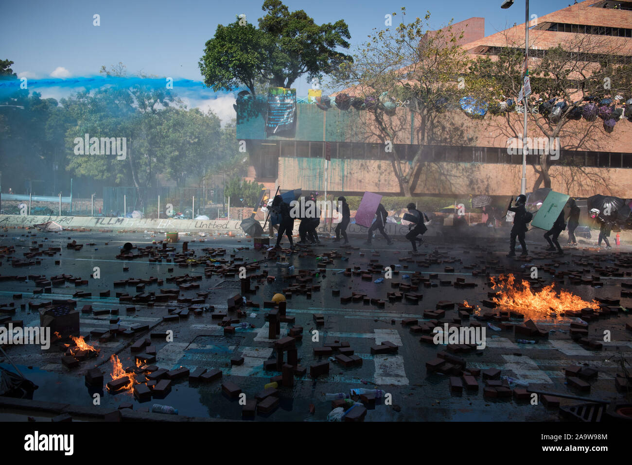 Hong Kong. 17th Nov, 2019. Protesters clash with police outside Hong Kong Polytechnic University.A police officer was shot in the leg with an arrow and an armoured vehicle was set on fire, as protesters continue to defend their makeshift base at the Polytechnic University. Credit: SOPA Images Limited/Alamy Live News Stock Photo