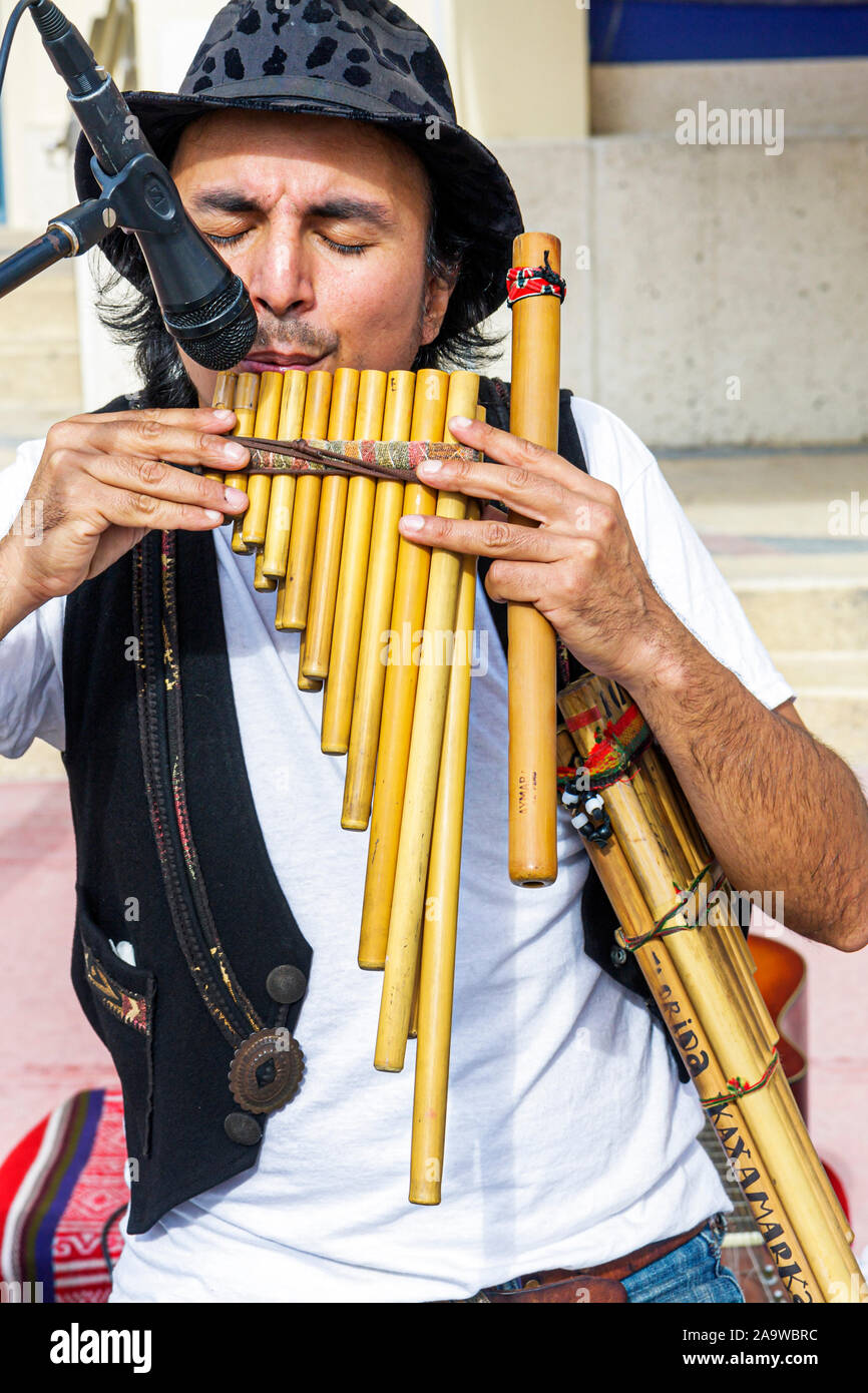 Miami Beach Florida,22nd Street,Collins Park Sunday Market,Hispanic man men male,plays Peruvian flute,microphone,FL100123052 Stock Photo