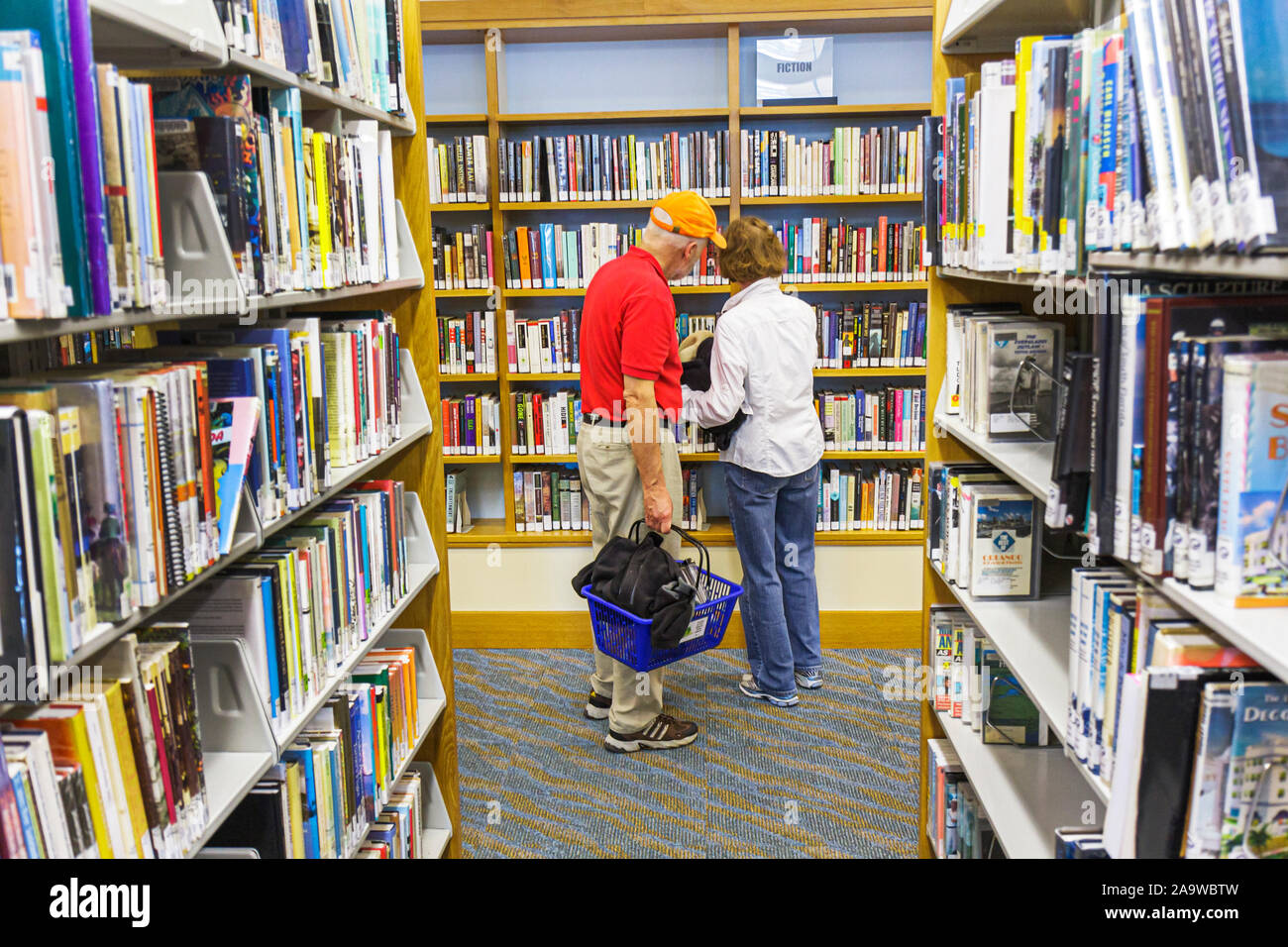 Miami Beach Florida,22nd Street,Public Library,man men male,woman female women,book,books,shelf shelves,FL100123053 Stock Photo