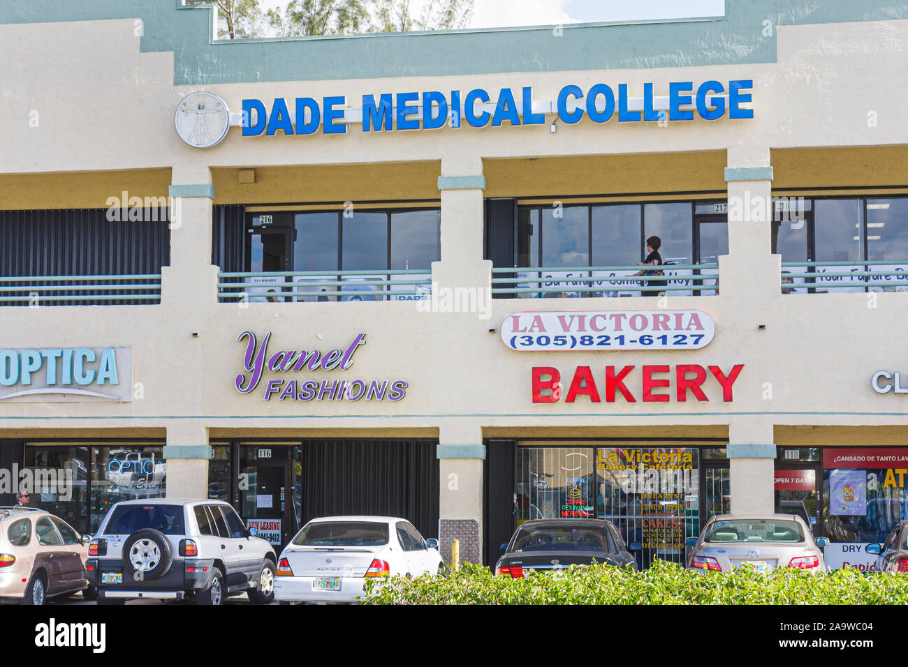 Miami Florida,strip mall,Dade Medical College,visitors travel traveling tour tourist tourism landmark landmarks culture cultural,vacation group people Stock Photo