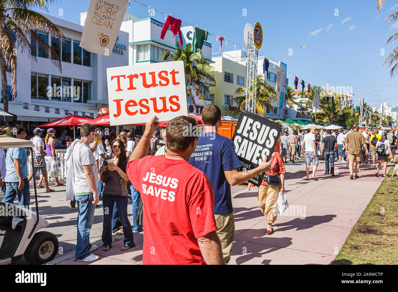 Miami Beach Florida,Ocean Drive,Super Bowl XLIV Week,NFL,football,sign,trust Jesus,street preachers,religion,FL100207167 Stock Photo