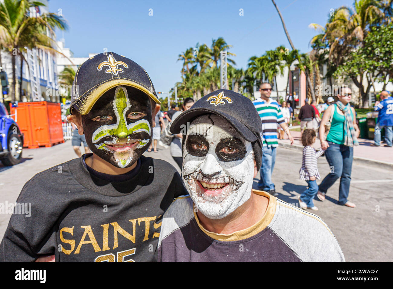 Miami Beach Florida,Ocean Drive,Super Bowl XLIV Week,NFL,football,father dad,parent,parents,son,New Orleans Saints,fans,visitors travel traveling tour Stock Photo