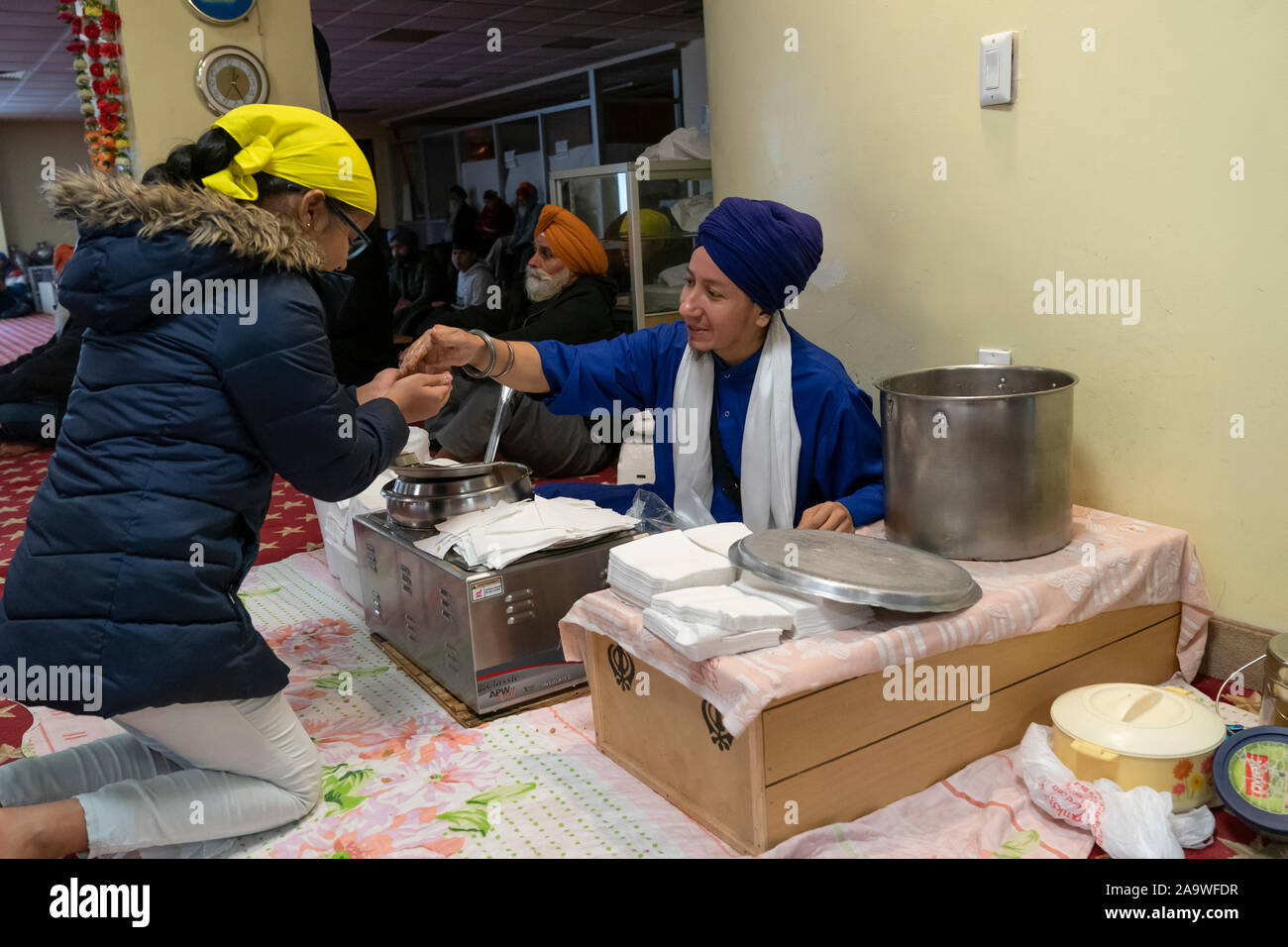 New York, NY - November 17, 2019: Special food distribution during 550th Birthday of Guru Nanak Dev Ji celebration at Sikh Cultural Society Stock Photo