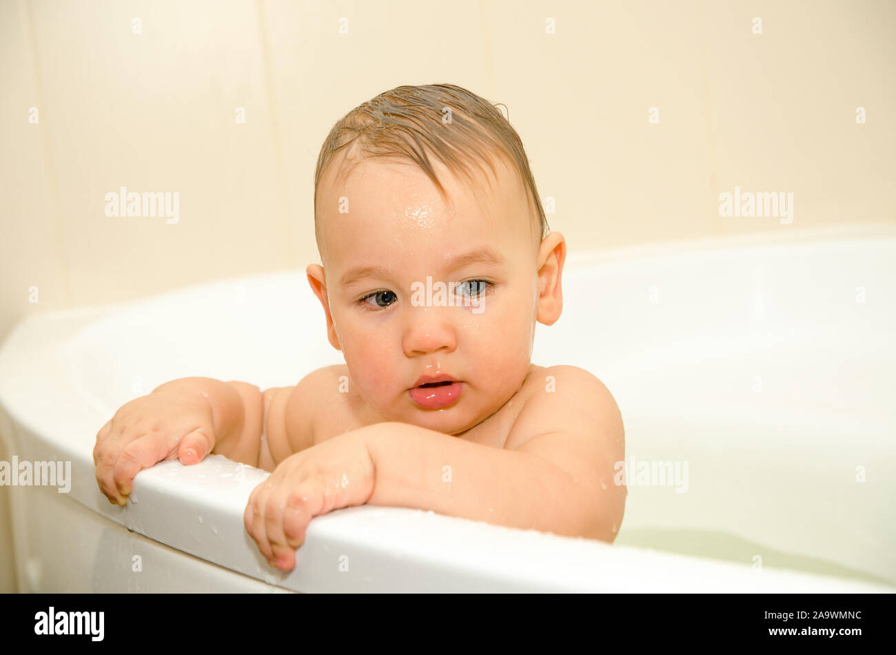 baby boy swimming in a bathroom Stock Photo Alamy