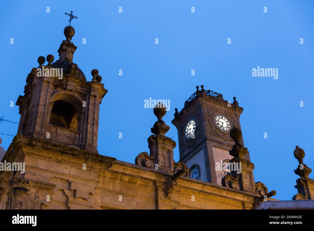 View of the bell tower of Lugo Cathedral before dawn in Lugo, Spain. The ancient city, famous for its intact Roman walls, falls along the Camino Primi Stock Photo
