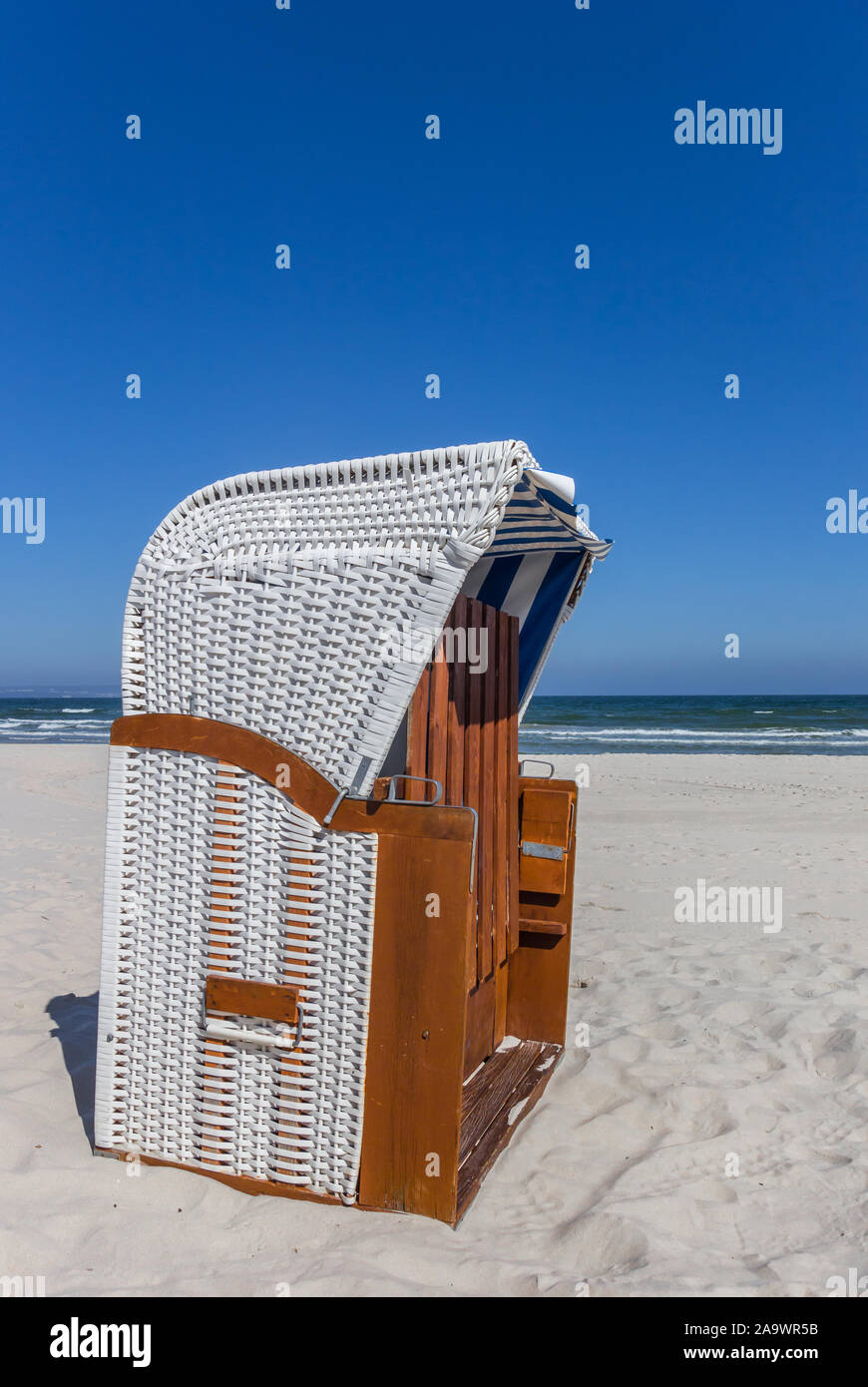 Traditional Strandkorb beach chair on Rugen island, Germany Stock Photo