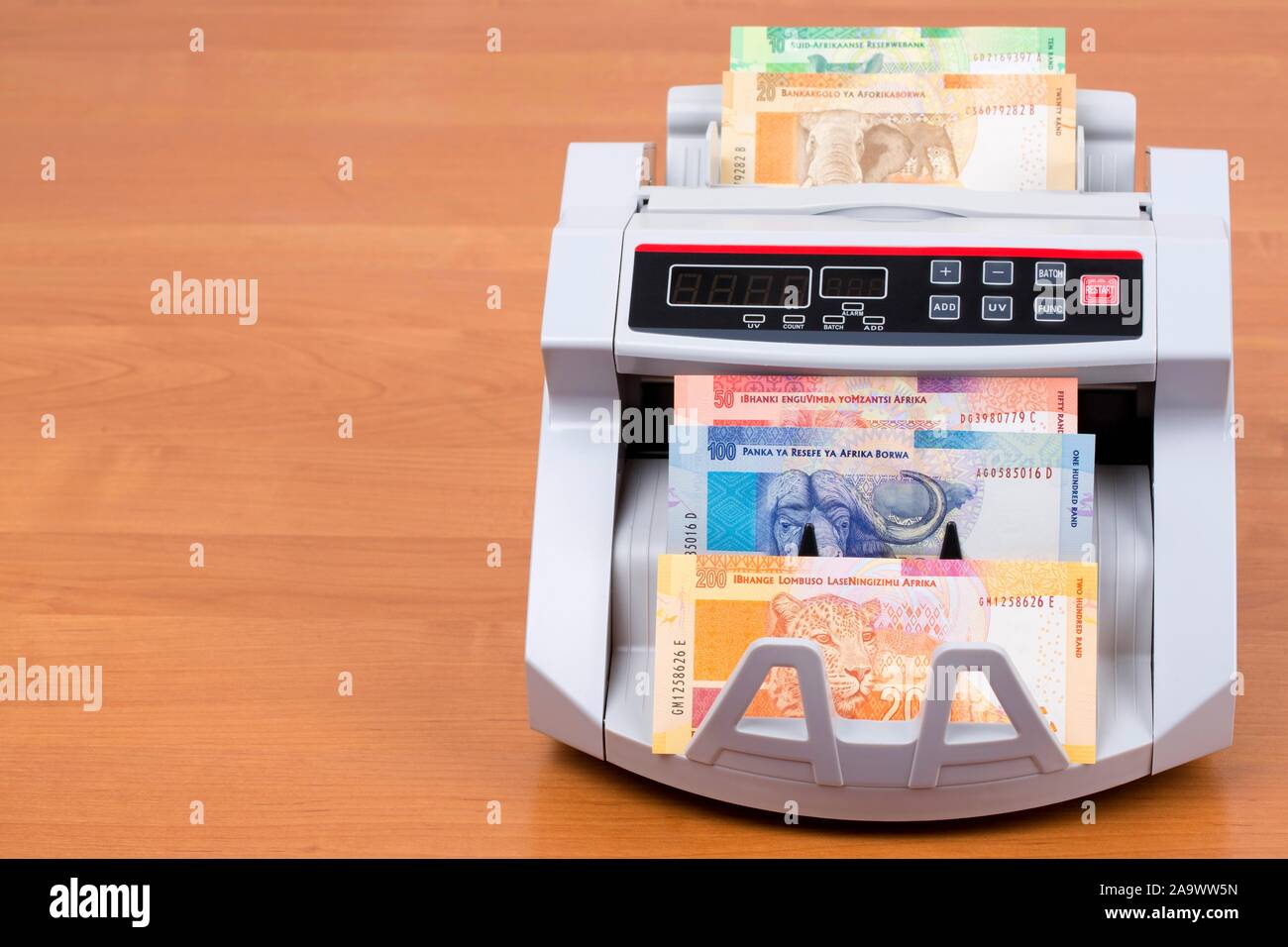 South African money in a counting machine Stock Photo Alamy
