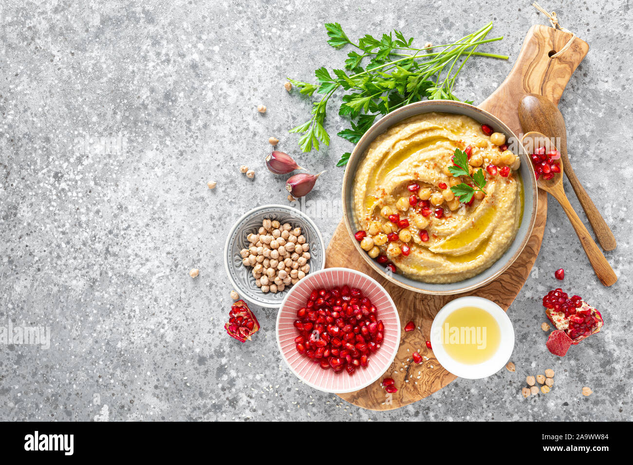Chickpea hummus with tahini in a bowl. Healthy vegetarian appetizer. Middle Eastern cuisine Stock Photo