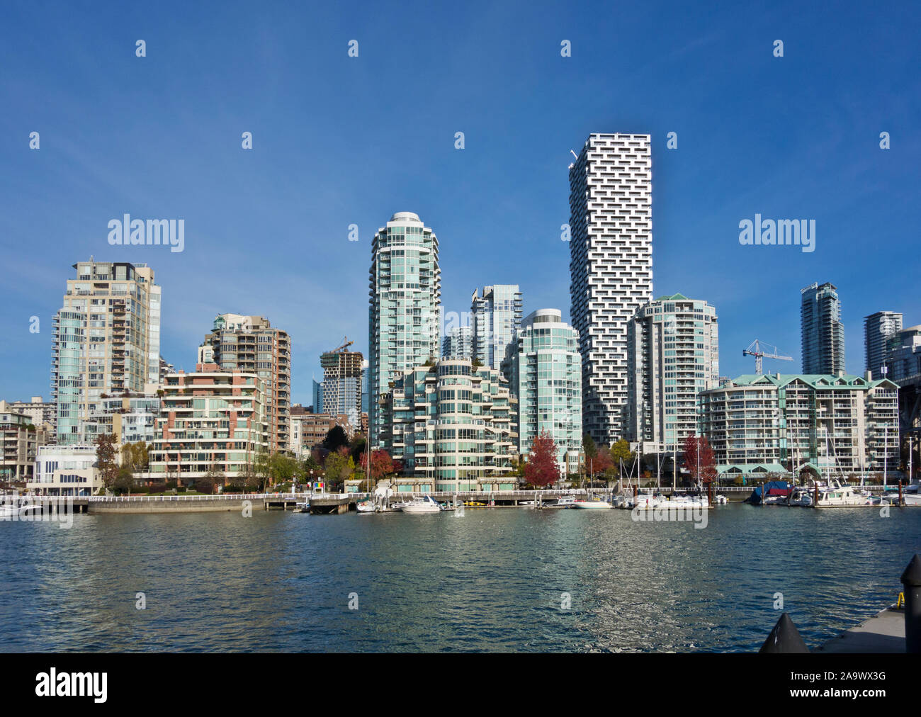 Highrise apartment buildings on the False Creek, Vancouver, British Columbia, Canada. Vancouver housing on the waterfront. Stock Photo