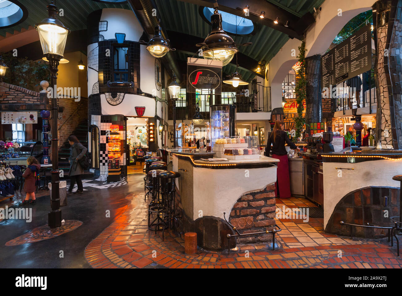 Vienna, Austria - November 1, 2015: The Hundertwasser Village cafe area was built both on the inside and the exterior by concepts of Friedensreich Hun Stock Photo