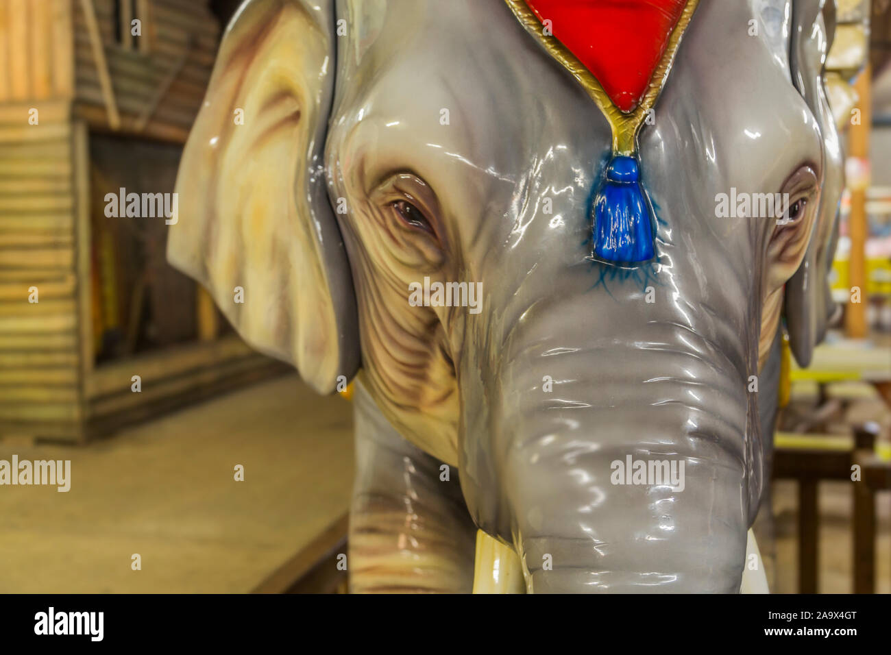Close up of a large model elephant wearing a head decoration. Stock Photo