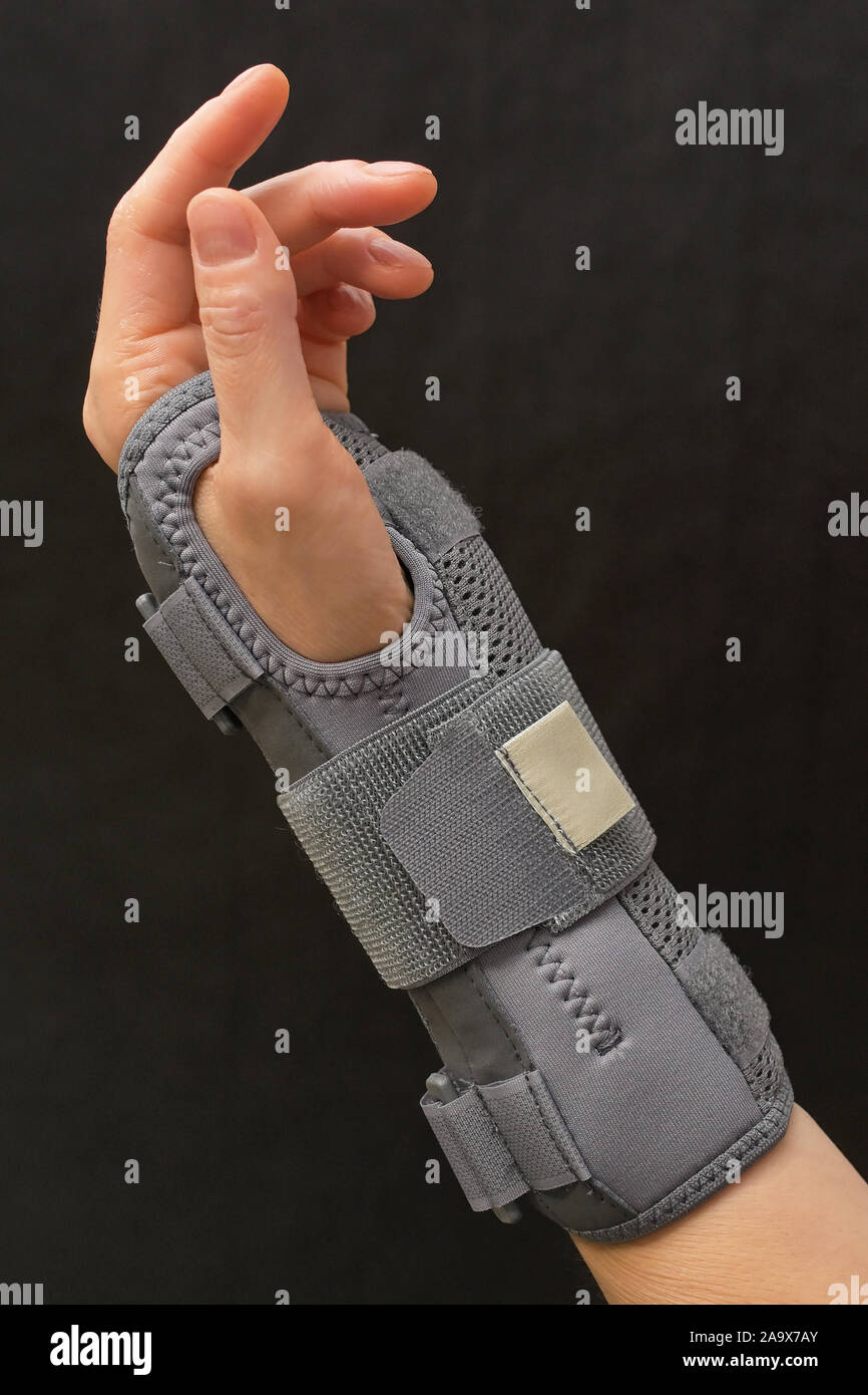 Contused Woman Hand In Stabilizer On Black Background Stock Photo Alamy<script async src=