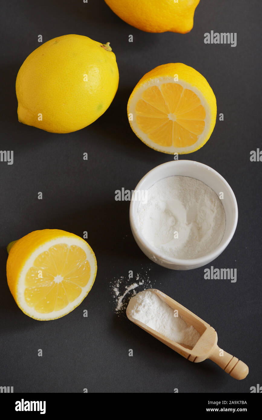 Lemon and baking soda on black background Stock Photo Alamy