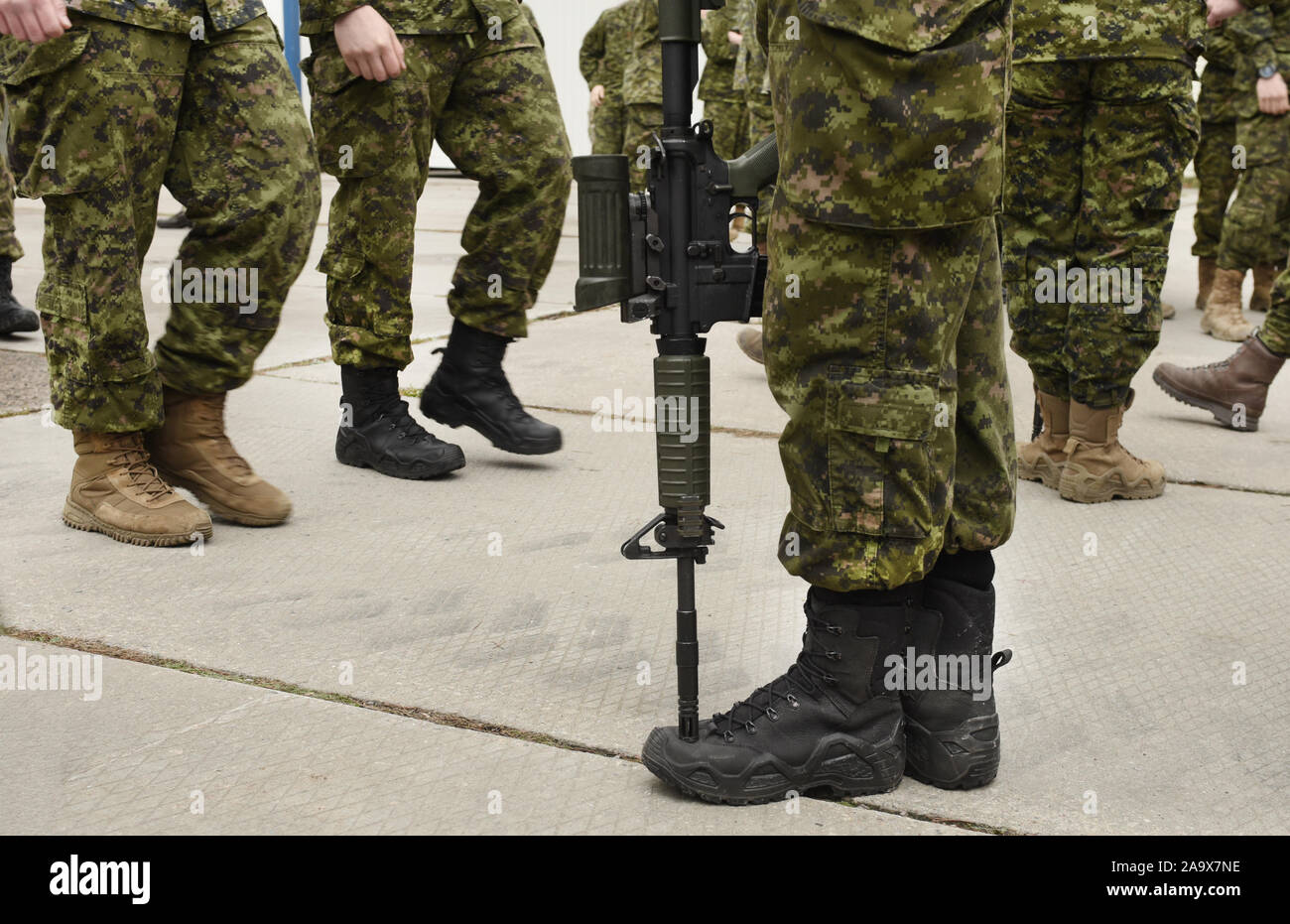 Soldier with weapon. Armistice. Armed forces, troops, army. Military concept. Stock Photo