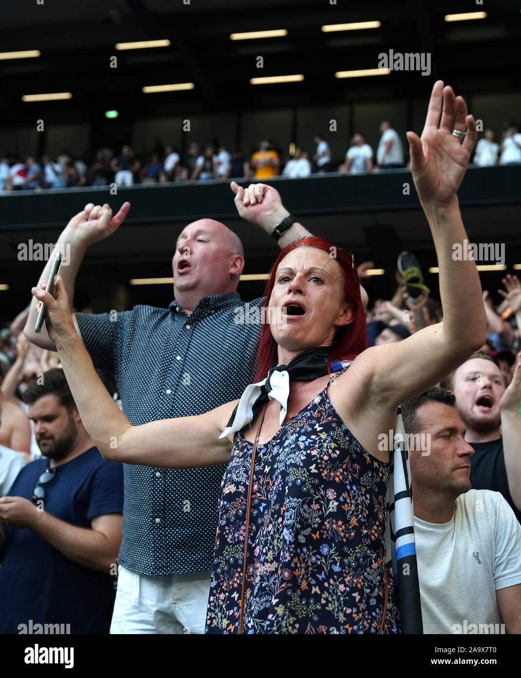 Fans Offering Support Fans in the stands show their support Stock Photo - Alamy