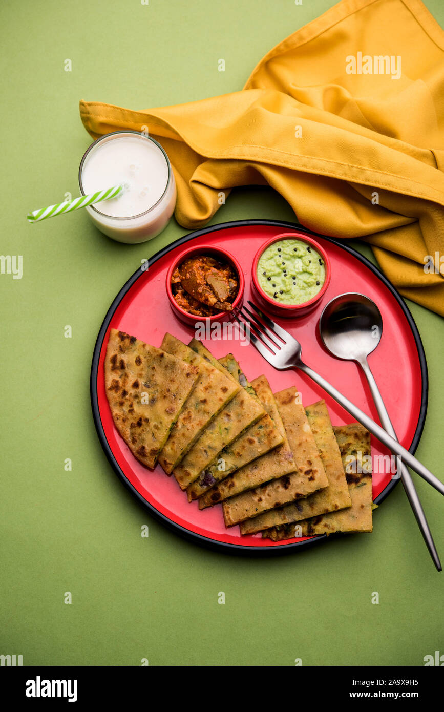 Aloo Paratha / Indian Potato stuffed Flatbread with butter on top. Served with fresh sweet Lassi