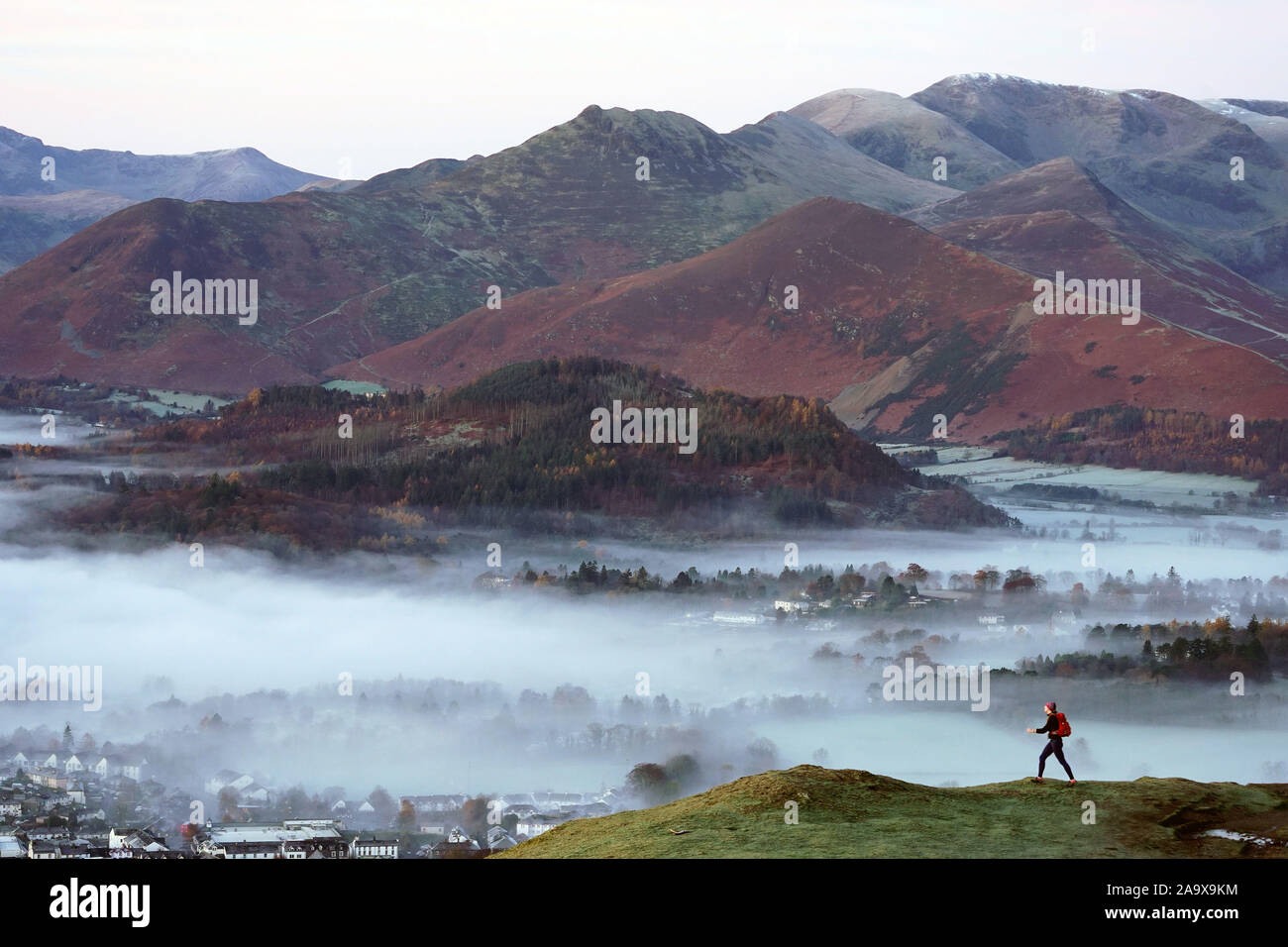 Mist caused by a temperature inversion over the town of Keswick in the Lake District after temperatures dipped to minus 2 degress Celsius. Stock Photo