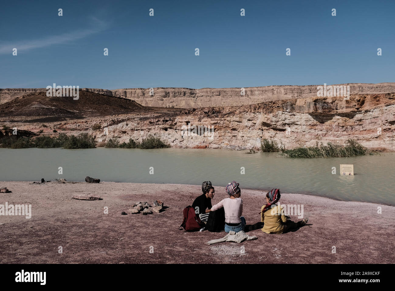 Mitspe Ramon, Israel. 17th November, 2019. An abandoned kaolinite quarry in the Ramon Crater seasonally floods with water creating unique pools in the midst of Israel's Negev Desert. Credit: Nir Alon/Alamy Live News. Stock Photo