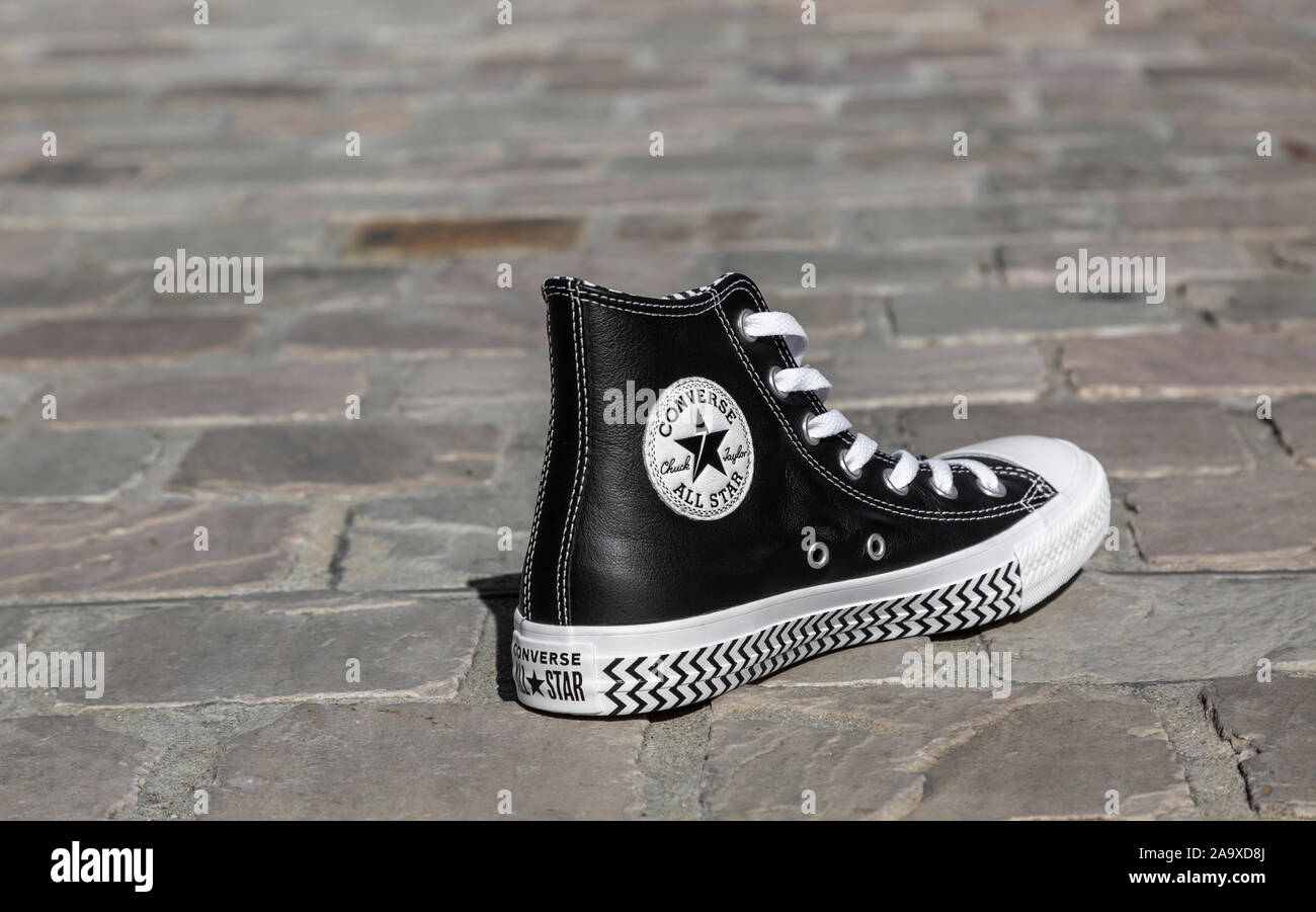 Schaap jogger Terughoudendheid Chartres, France - Spetember 2, 2019: Image of an All Star Converse sneaker  on a cobblestone street Stock Photo - Alamy