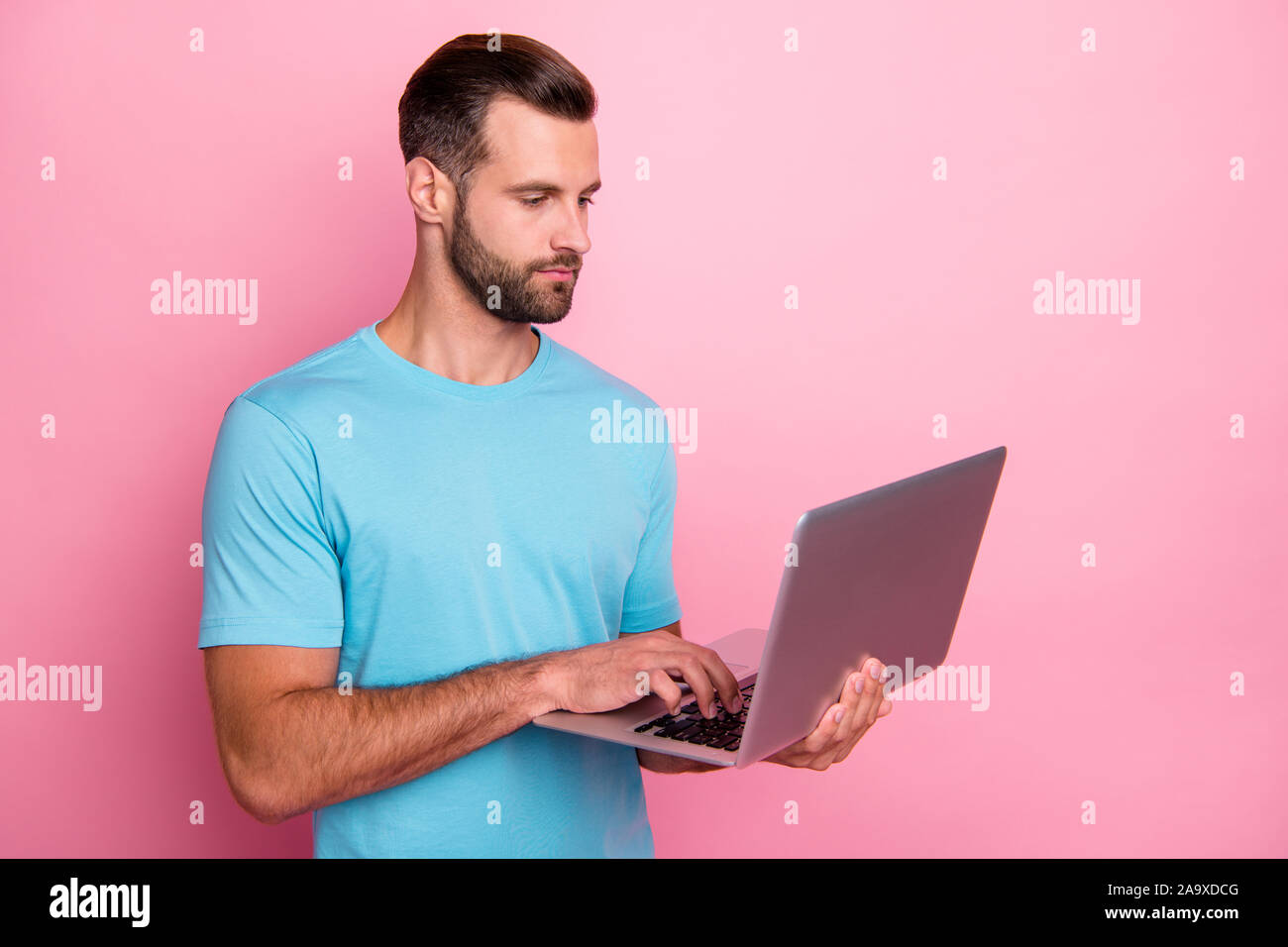 Photo of serious man looking puzzled into lap top electronic device ...