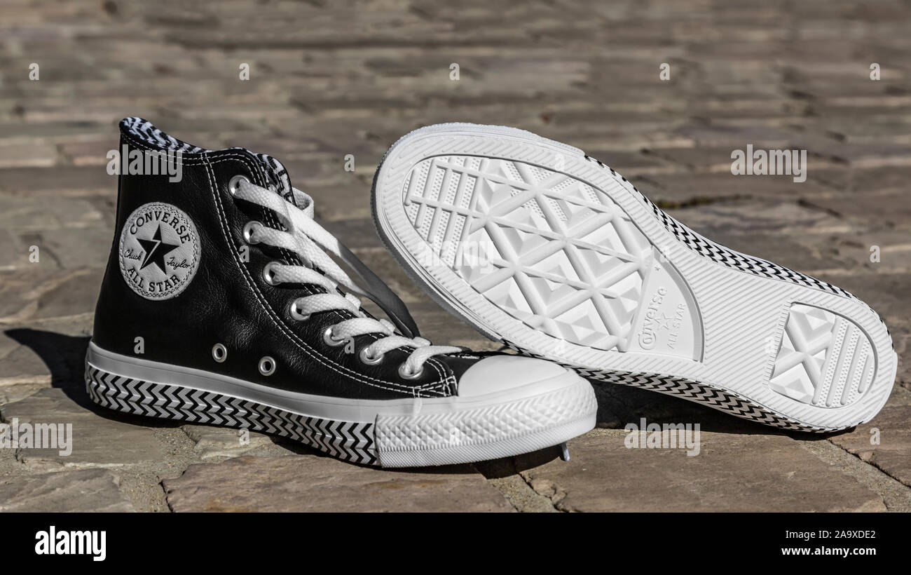 Chartres, France - 2, 2019: Image of a pair of All Converse sneakers on a cobblestone street Stock - Alamy