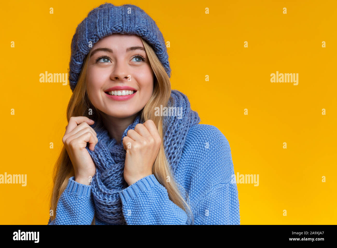 Portrait of beautiful girl in blue knitted winter set Stock Photo