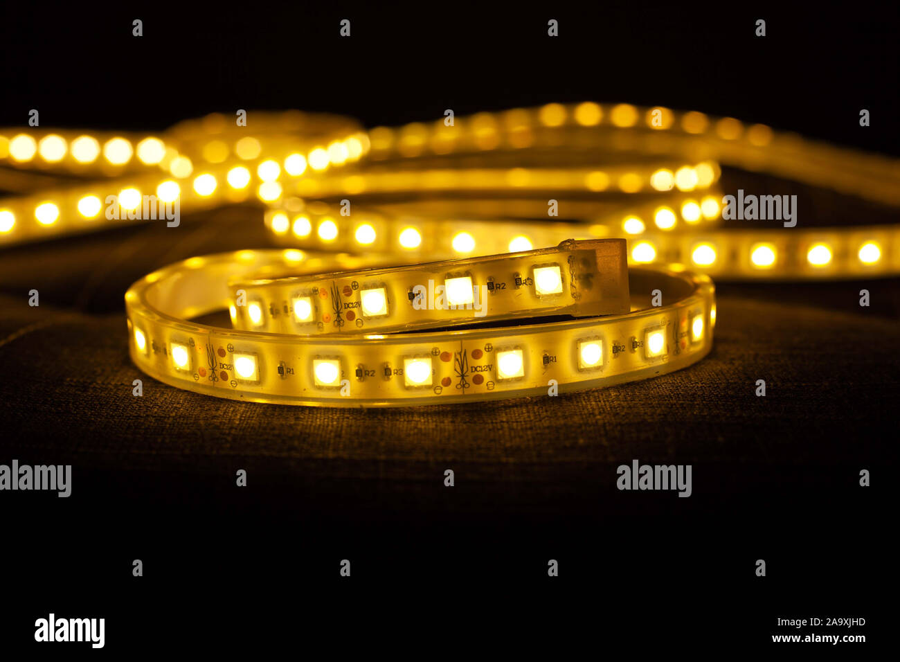 LED strip on dark gray background.Diode type electric lamp. Stock Photo