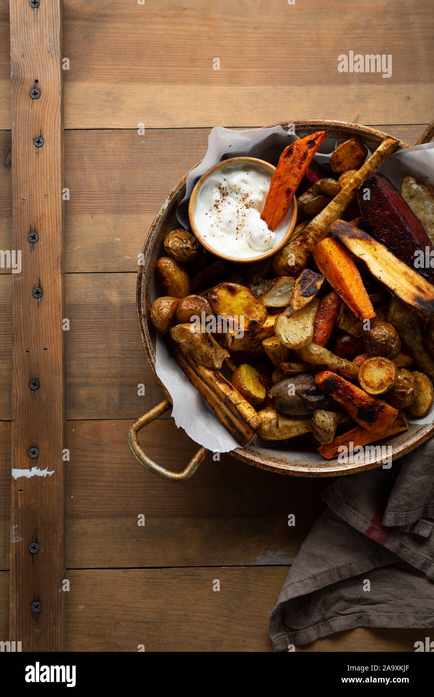 Baked vegetables potato and carrots in pan Stock Photo