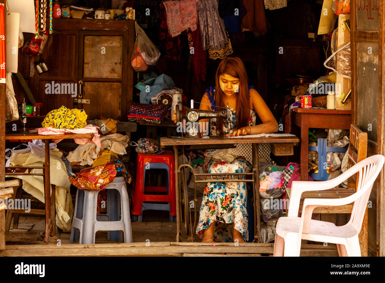 A Young Woman Working In A Traditional Workshop, Mandalay, Myanmar. Stock Photo