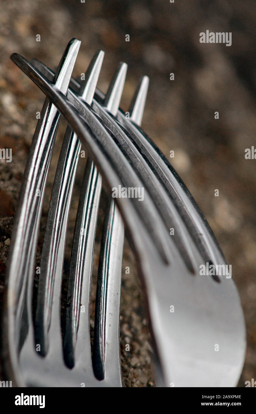 interlinked metal kitchen forks Stock Photo