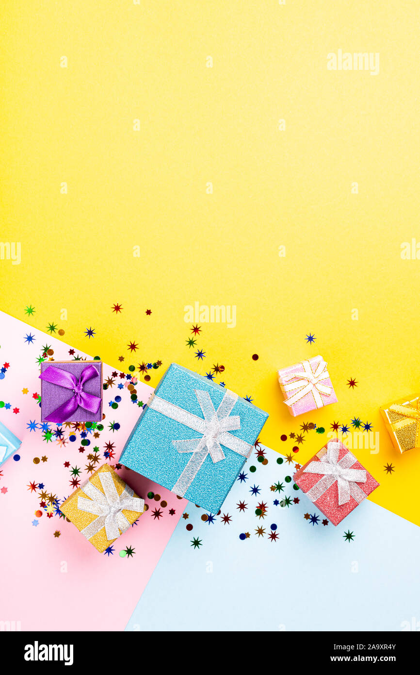 Festive background with colorful gift presents Stock Photo - Alamy