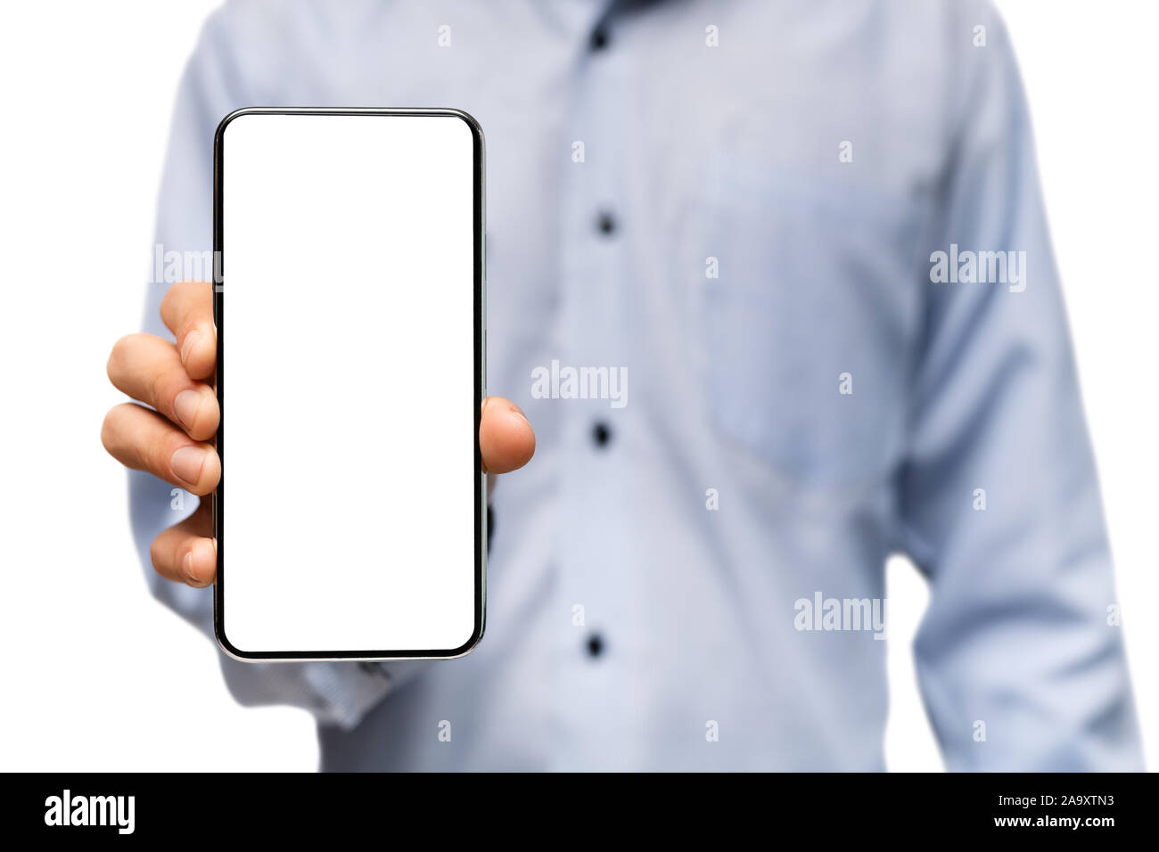 Modern smartphone with blank screen in hands of unrecognizable man ...