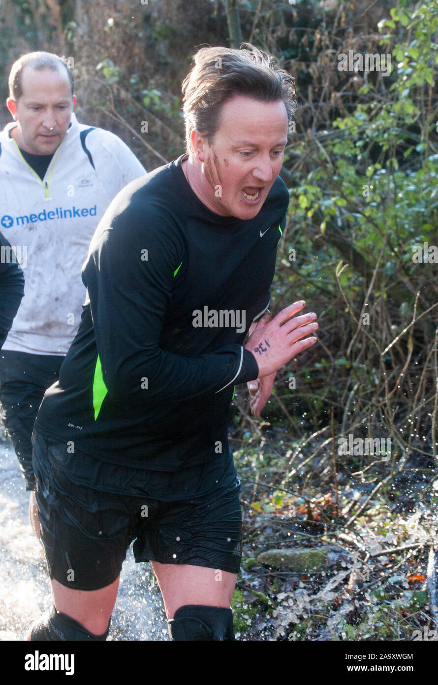 The Prime Minister David Cameron competing in the Great Brook Run in his Witney constituency village of Chadlington in December 2014. The Great Brook Run is an annual mile-long cross country run following  a path along the village stream called Coldron Brook passing through a 3-foot tunnel under a bridge. Stock Photo