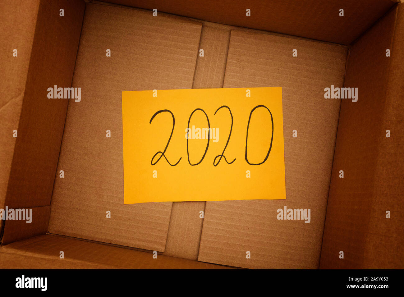 Download 2020 Year On Yellow Paper Note Inside A Cardboard Box Close Up Stock Photo Alamy PSD Mockup Templates